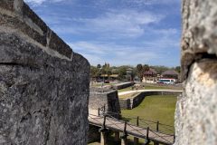 Look through the wall into the moat at Inside look of the wall at Castillo de San Marcos National Monument