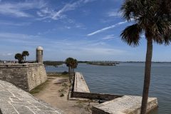 Looking at the tower and the ocean at Castillo de San Marcos National Monument