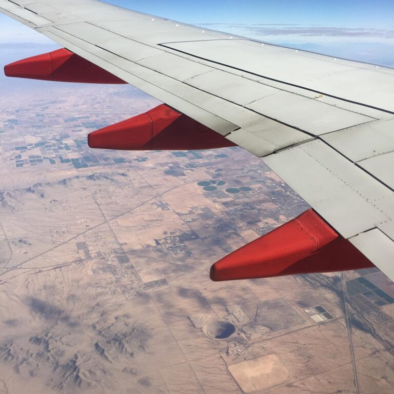 When Travel Plans Fall Apart view from airplane window during travel
